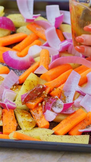 Make za’atar chicken the easy way! Chicken thighs, carrots, and potatoes roast together in a lemon and za’atar sauce until everything is tender, lightly charred, and fragrant. https://themeddish.com/Sheet-Pan-Zaatar-Chicken | The Mediterranean Dish