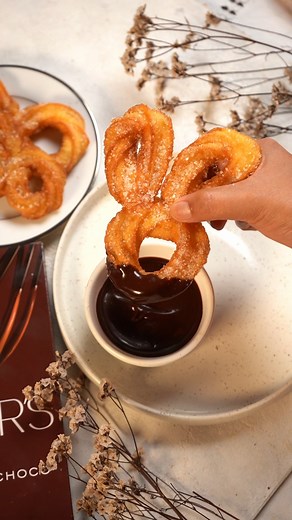 Hop into a world of sweetness with these irresistibly cute Bunny Shaped Churros—perfect for your next treat or celebration! 🐰🍫 Bunny Shaped Churros Churro dough: 1 cup water 60g butter 1.5 tbsp sugar 1⁄2 tsp salt 1 cup flour 1 large egg 1 egg yolk Chocolate dipping sauce: 100g dark chocolate, chopped 100ml whipping cream For the churros: 1. Heat butter, water, sugar and salt in a saucepan on the stove. 2. When this starts to bubble, remove from heat and stir in the flour. 3. Place back on the 