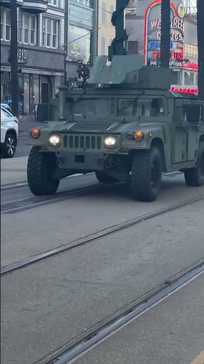 National Guard arrives in New Orleans, driving Humvees down Bourbon Street