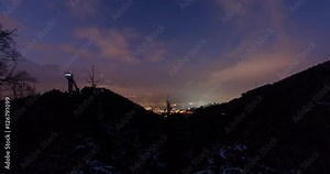 Innsbruck, Austria - Ski Jump Bergisel with the city of Innsbruck in the background after sunset - Timelapse with motion