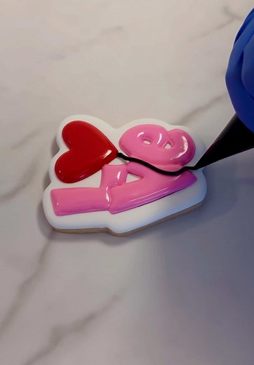 Spreading the love one cookie at a time! 💕 Watch as this Valentine’s Day cookie go from plain to perfectly sweet 🍪 #ValentinesDayCookies #CookieDecorating #BakingLove #SweetTreats #ValentinesDIY #DessertGoals #CookieArt #BakeWithMe #HolidayBaking #LoveInEveryBite #FoodieContent #CreativeBaking #BakingTutorial #SugarCookies #TikTokBaking #TreatYourself #CustomCookies #HeartShapedCookies #MadeWithLove #SatisfyingVideos
