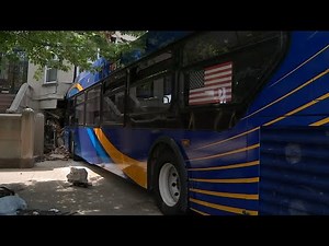 Bus footage shows driver crashing into building