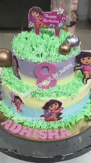 2 tier Adorable Dora theme cake specially crafted for a super special day of a cute Dora lover girl.