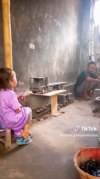 Engaging Child Activity with Toy Truck and Cup