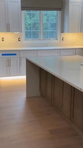 A clean, elevated palette with layered lighting, beautiful cabinetry, and waterfall-edge quartz countertops—designed for everyday beauty and utility. From layout design to cabinetry assembly and quartz installation, our team helped bring this spacious, light-filled kitchen to life with timeless, practical details. | Elegant Kitchen And Design