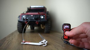 I FINALLY add a winch to my Traxxas TRX-4 Defender! As my first ever crawler, it was long overdue.. The new wireles remote from RC4WD is modeled after a real winch controller! Since I'm still using the stock TRX-4 transmitter (no available channels), this setup is perfect because it is all external and requires no transmitter programming. Check out my full video & install: https://youtu.be/lLXZ9KERvrM | RC Girl