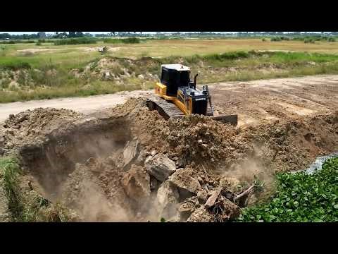 The dozer maneuvering the machinery precision to achieve the desired ground elevation and contour