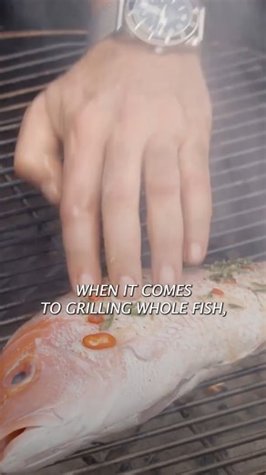 50K views · 467 reactions | My favorite fish to grill? Red snapper – it’s versatile, it’s economical and it cooks quickly. Watch as I share a few simple tips to take your grilled fish to the next level. I like to season it with a simple garlic and herb olive oil marinade, and serve it with a mixed herb salad and grilled lemons. Click the link in my bio for the complete recipe. | Andrew Zimmern | Facebook