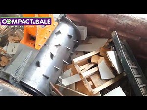 Roll packer compacting mixed waste - No machine does what Packmat does