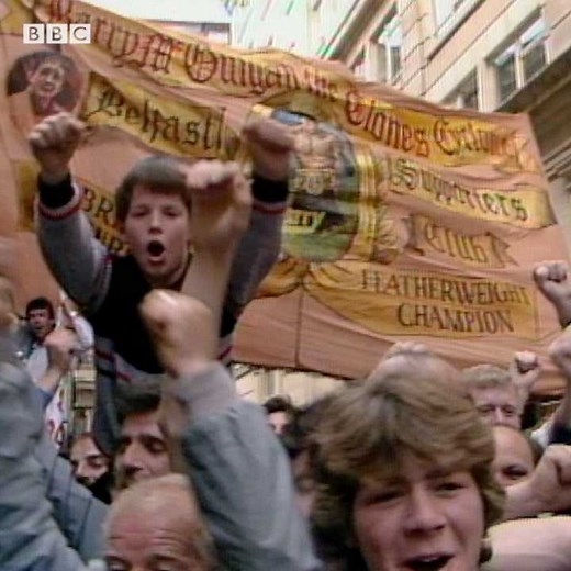 #OnThisDay 1985: BBC News reported on angry scenes at the weigh-in ahead of Barry McGuigan's big fight against Eusebio Pedroza that night. Relive the WBA world featherweight title fight blow-by-blow, on the BBC Sounds Replay podcast - https://www.bbc.co.uk/programmes/p074mk3m | BBC Archive