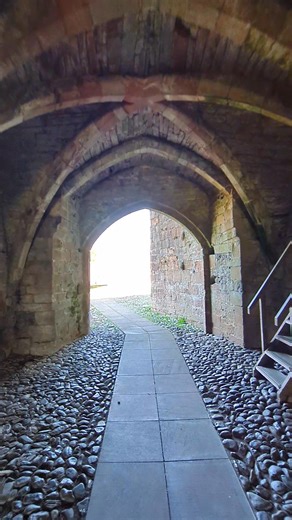 Walking through the gatehouses at Brougham Castle The double gatehouse is an unusual feature of a castle. The outer and inner gatehouses are separated by a courtyard, passing through the two gatehouses will lead you to the central courtyard. The inner gatehouse was built first, it contained a portcullis and postern gate. The outer gatehouse had a room for guards whilst the courtyard contained lodgings that face the River Eamont. Both gatehouses were built in the 13th century. #cumbria #borders #