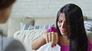 Zoom in of sad Latin woman crying hysterically while sharing feelings with unrecognizable psychotherapist, then blowing her nose into handkerchief and covering face with hands Stock Video