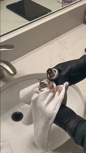 How to clean the pop-up stopper in a slow bathroom sink