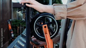 girls uses scooter sharing via smartphone and qr code