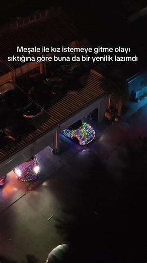 Aerial Night Journey of Colorful Car Convoy