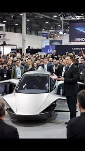 Elon Musk presents a futuristic flying car prototype at a tech exhibition, with an awestruck crowd. Elon musk “New model arriv let’s Drive”🚀#ElonMusk#FlyingCar#FutureTech | Team Shawaiz Official