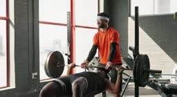 Man, fitness and weightlifting barbell with partner at gym for...