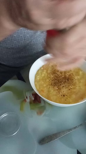 Enjoying a Comforting Bowl of Vegetable Soup