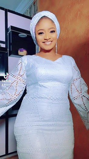 Elegant White Dress with Intricate Cut-Out Design