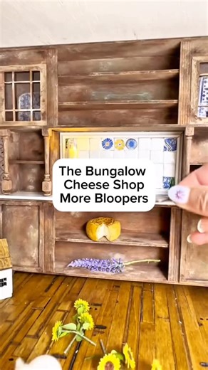 What’s a dollhouse makeover without bloopers? You guys seem to like watching my fails so here’s more! I renovated a tiny bungalow dollhouse into a cheese shop and the struggle is real! I’m a hot mess “Use the museum wax!” They say 😂😂 If you like DIY, miniatures, cozy projects and watching me drop everything while gluing my hands together… this is for you! #dollhousedesign #dollhouserenovation #diy #blooper #cozydecor #miniatures #hobby #fails | DomnDiva Design