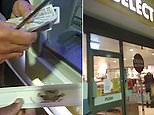 'Look, £130!': Passers-by uncover metal bar trapping money at cashpoint
