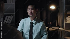 Financial Analyst Talking to Investment Banker in Late Evening at Work. Chatting About Real-Time Stock Chart Data on Desktop Computer.