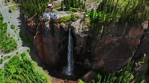 Summer green Telluride Bridal Veil Falls Waterfall Colorado powerplant house aerial drone Box Canyon Black Bear Pass Road Rocky Mountains 4wd hiking blue sky cliffs Uncompahgre Forest birdseye circle