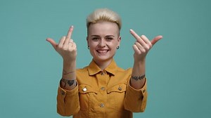 Portrait Girl Demonstrating Obscene Gesture On Stock Footage Video (100% Royalty-free) 1100078249 | Shutterstock