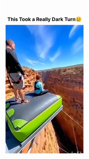 Creative Tom on Instagram: "A 10-second Instagram reel shows a man and a young child leaping from a green inflatable mattress suspended above a dramatic red-rock canyon—resembling Antelope Canyon—before landing in a large mesh net that funnels them through a central opening to a padded surface below. Captioned “This is really crazy,” the clip rapidly drew attention, surpassing 1.9 million views and 167 replies within hours. While it aligns with the ongoing trend of family-oriented extreme-sport
