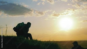 Helping Hand. Man giving hand a male to help her to climb the mountain. Help and assistance, hand reaching out to help friend at beautiful sunset sky. Hiking and team work concept. People helping. Stock Video
