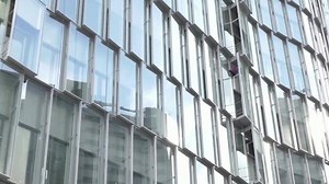 French 'Spider-Man' climbs skyscraper for climate