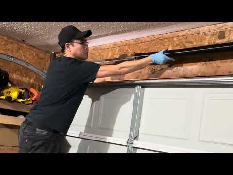 Replacing broken garage door torsion spring tutorial fix repair installation instructions