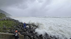 Super typhoon blowing by northern Philippines and Taiwan forces evacuations and closures