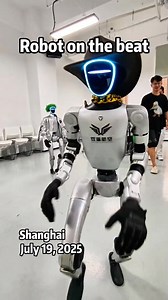 2K views · 35 reactions | Robot on the beat A humanoid #robot performs breakdance moves as another robot circles nearby, appearing ready to join the routine at Shanghai Jiaotong University. | The Belt and Road News Network | Facebook