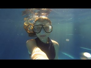 Selfie swim with underwater girl having fun blowing bubbles! #H2Opus #underwaterphotography