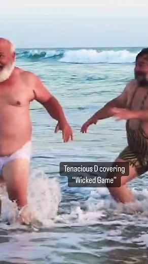 What a wicked thing to do, Tenacious D Jack Black and Kyle Gass hit the beach in their cover of Chris Isaak’s top-10 song from 1989 ⛱️ | SPIN
