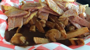 Poutine fit for a Canadian Queen, who loves bacon