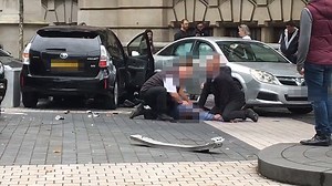 Man restrained by bystanders after car hits people in London