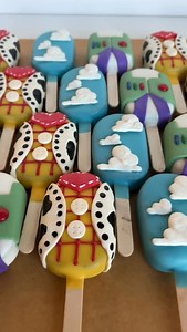 Shannon • Dip & Duo on Instagram: "Pretty obsessed with these Toy Story cakesicles 😍🥹 I hope 2 special little boys enjoy their birthday treats!! Medium cakesicle cutter: @daisymakes_innovations Chocolate: @stoverandcompany sky blue, sunshine yellow & ultra white #toystorycakepops #toystorycakesicles #toystorytreats #treatmaker #lancasterpatreats #cakepops #cakesicles"