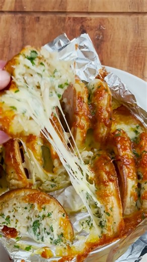 We’ve taken cheesy garlic bread to new heights by swapping out regular bread for crumpets. The crumpet holes soak up all that melted garlic butter 😍. Click the link in our Instagram bio for the full recipe or Google “Taste air fryer crumpet garlic bread”. Recipe by Tiffany Page #airfryer #airfryerrecipe #airfryerrecipes #foodhacks #garlicbread | Taste.com.au