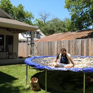 Daredevil Dan jumps into a trampoline pit of 1,000 mousetraps and sets them all off in just 4 seconds. He even gets one caught in his hair! | The Slow Mo Guys