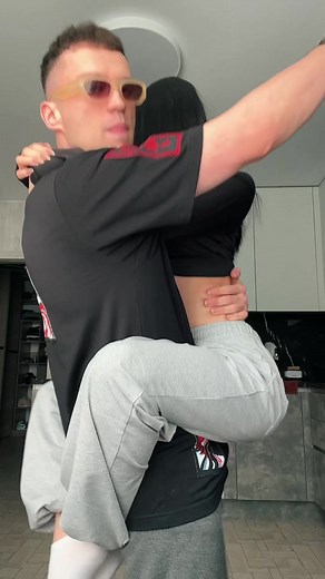 Playful Kitchen Moment Between Friends