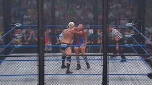 Kurt Angle battles Mr. Anderson in a cage match. | TNA Wrestling UK