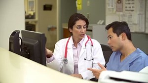 Male Nurse Female Doctor Looking Computer Stock Footage Video (100% Royalty-free) 5856191 | Shutterstock