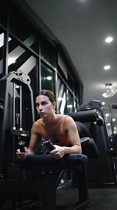 Young Sportive Woman Workout Exercising with Jumping Step Platform at Fitness Center or Gym. Fitness and Wellness Concept.