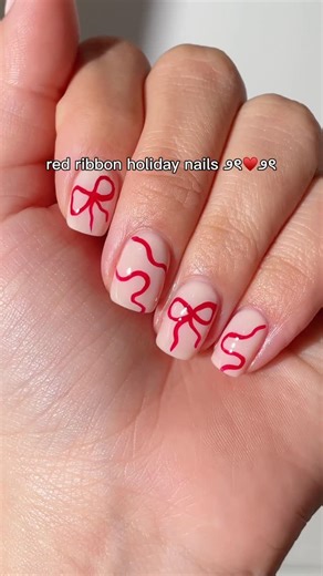 Avon USA on Instagram: "You can never go wrong with a touch of red for the holidays! ♥️ These ribbon inspired nails are the perfect way to get into the holiday spirit! 🎁🎄 Shade: 🍒fmg Glimmer Nail Lacquer Supernova Red"