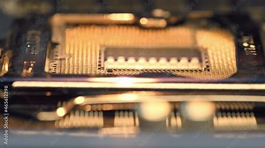 Close up view to the processor socket on the circuit board. Macro video of the electronic components on the computer motherboard. Empty slot for neural cpu for computing tasks of research laboratory.