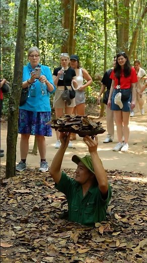 A Soldier Shows How to Enter the Tiny Cu Chi Tunnel Entrance