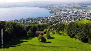 Spectacular panoramic view of the city of Zug on the shores of Lake Zugersee in Switzerland featuring stunning scenery of the lush green Swiss countryside