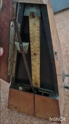 A VERY old metronome.